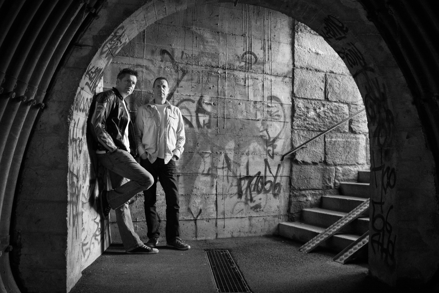 Mike and Jason against a graffiti wall