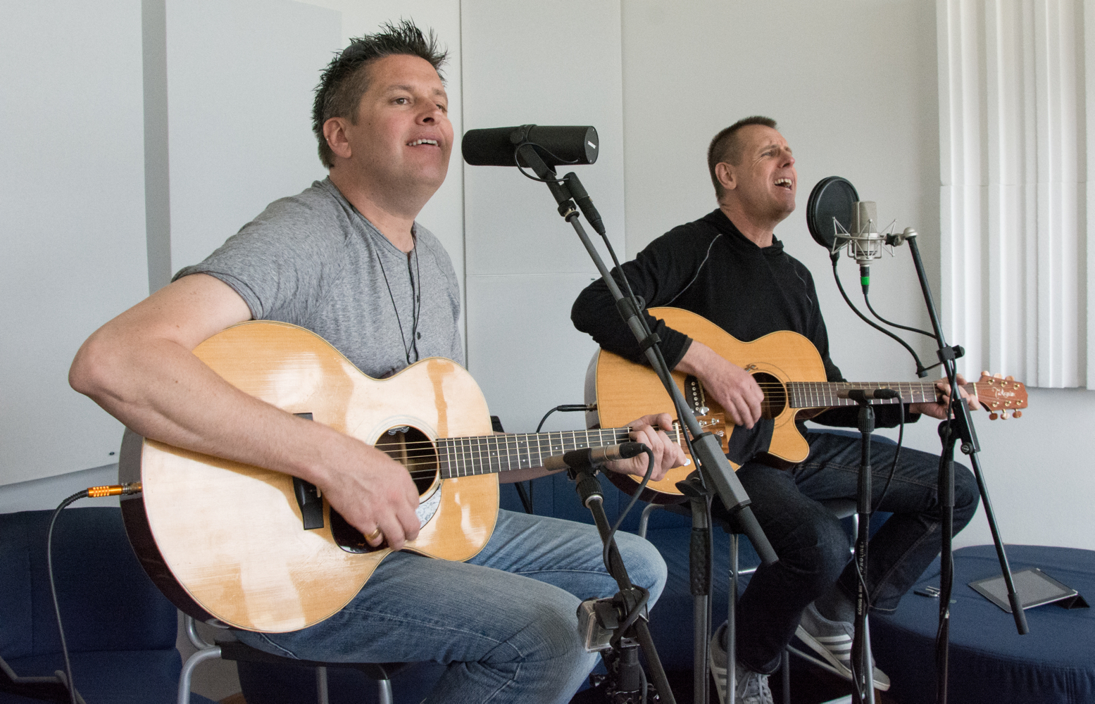 BOOTS playing acoustic guitars