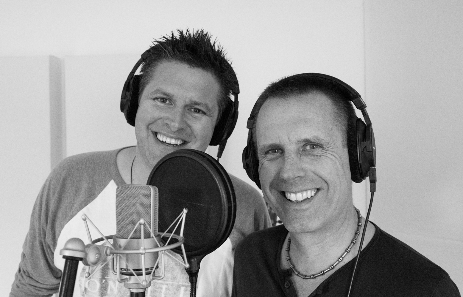 Mike and Jason recording with headphones